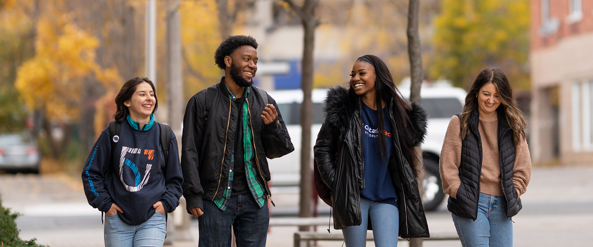 Group of students walking outside in downtown Oshawa in the Fall
